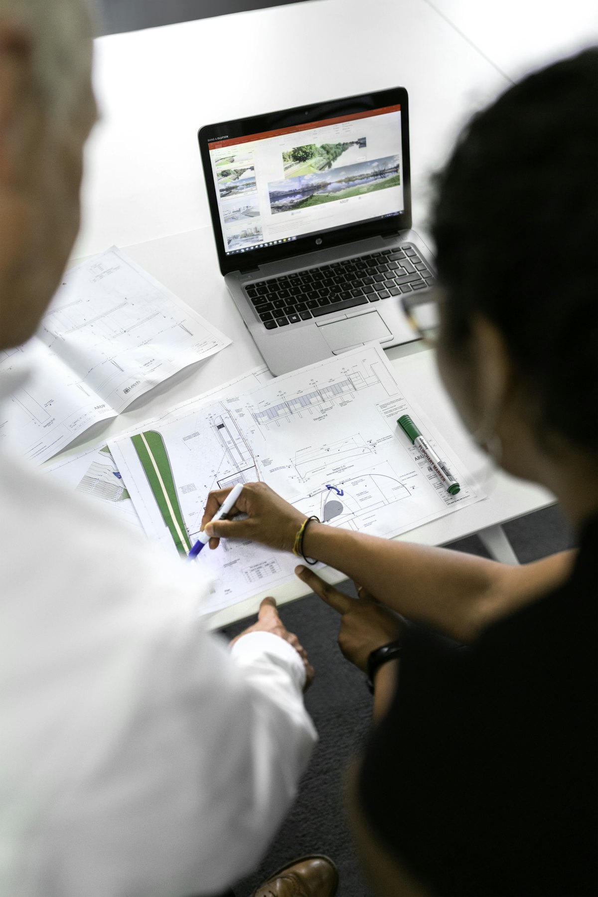 Engineers reviewing technical plans